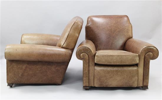 A pair of 1940s French tan leather upholstered armchairs, W.3ft 1in. D.3ft 1in. H.2ft 8in.